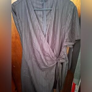 Elegant Black Romper with faux wrap skirt